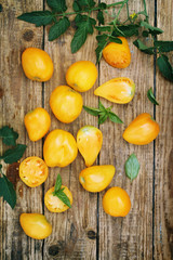 tomatoeson a wooden board, top view