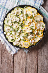 carpaccio of zucchini with cheese and herbs close up vertical top view
