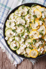 carpaccio of yellow and green zucchini vertical top view macro
