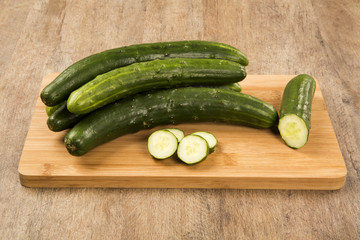 Fresh cucumber on the wooden table