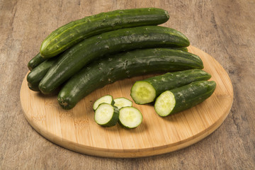 Fresh cucumber on the wooden table