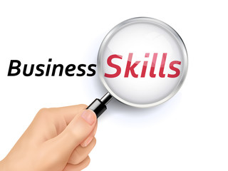 business skills showing through magnifying glass