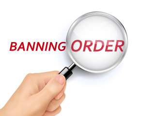 banning order showing through magnifying glass