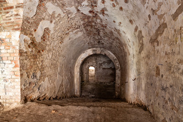 Fototapeta na wymiar Old stone staircase leads to the dungeon. Fort Tarakanovskiy. U