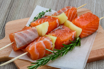 Raw salmon skewers