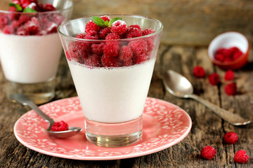 Summer panna cotta with fresh berries in a glass
