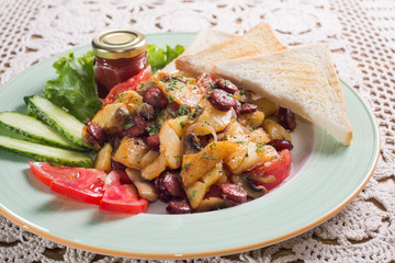 Fried potatoes with sausages. Homemade food