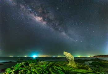 Foto auf Acrylglas Milky Way in Ancient stone park on a summer night at 2 am,   galaxies stretching giving shimmering sky in the night, beneath a rock galaxies toward accent for photos © huythoai