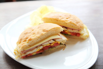 Club sandwich with on wood background