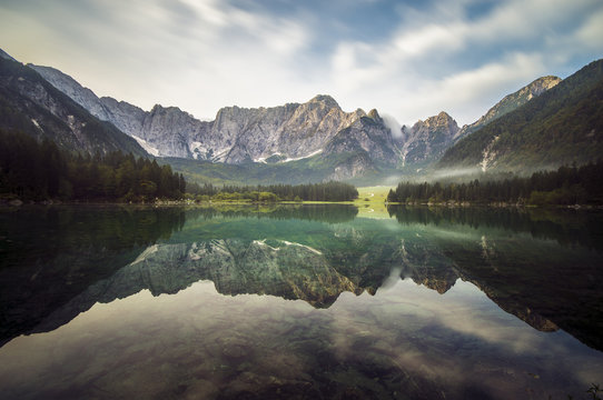 alpine mountain peaks reflecting in a mountain lake