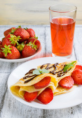 Pancakes with sliced strawberries