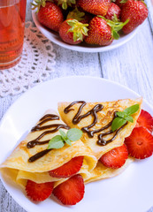 Pancakes with sliced strawberries