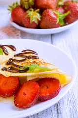 Pancakes with sliced strawberries