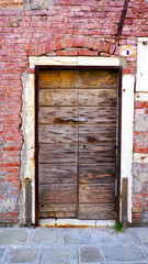 antique wooden door and old brick wall