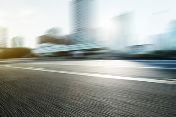 Blurred motion of modern skyline and urban street