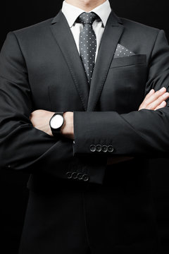 man in suit on a black background