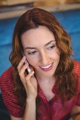 Fototapeta premium Woman using her mobile phone