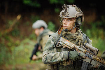 Portrait of a ranger in the battlefield with a gun