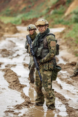 Portrait of a ranger in the battlefield with a gun