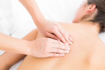 Obraz na płótnie Canvas Pretty woman enjoying a back massage