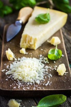 parmesan cheese on wooden cutting board