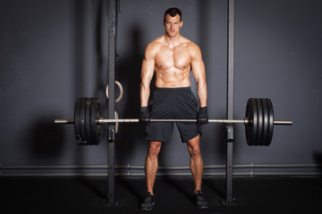Naklejka na ściany i meble Weight lifting fitness training man
