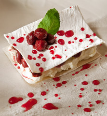 dessert with cherry, mille feuille with whipped sour cream. filo cake