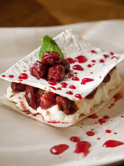 Delicate filo cake, drunken cherries whipped cream