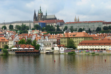 Obraz premium View of colorful old town and Prague castle with river Vltava, Czech Republic