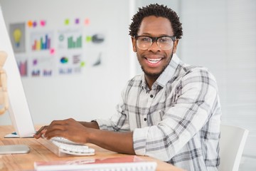 Fototapeta premium Young businessman smiling at the camera