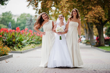 Stylish bridesmaids have fun with bride