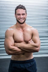 Obraz premium Portrait of smiling muscular man looking at camera