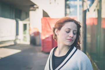 Beautiful girl posing in the city streets