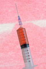  Syringe and Needle in Close Up.
Logos removed