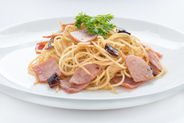 Spaghetti with ham and chilli  isolated on white background