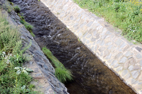 The flow of the water in the drainage canal