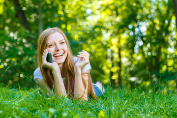 Beautiful smiling red-haired young woman