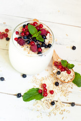 yogurt with berries and oat flakes