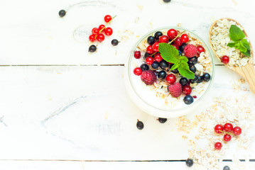 yogurt with berries and oat flakes