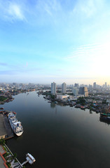 Fototapeta na wymiar Aerial view of Bangkok Skyline along Chaophraya River at dusk wi