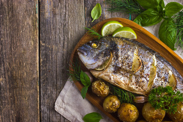 baked dorado with spicy herbs and potatoes