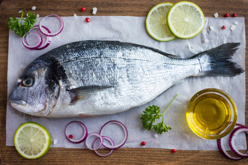 fresh raw dorado fish with spices