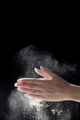 Obraz na płótnie Canvas woman coating her hands in powder chalk magnesium