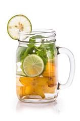 Infused fresh fruit water of starfruit, mint and lime. isolated