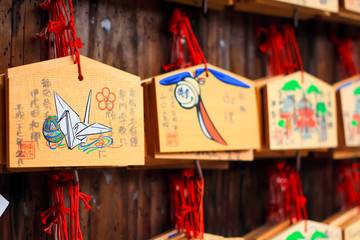 Wood player plate (Ema) at Fushimi Inari Shrine, Shinto place in Kyoto,Japan
