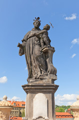Fototapeta na wymiar Statue of St. Anthony of Padua on Charles Bridge in Prague