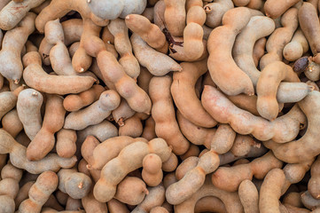 Sweet tamarind on wood plank.