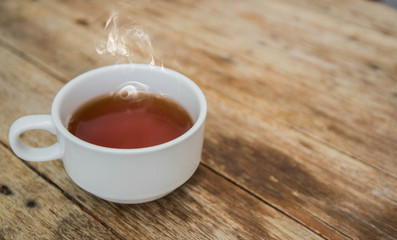 Cup of tea on a wooden background