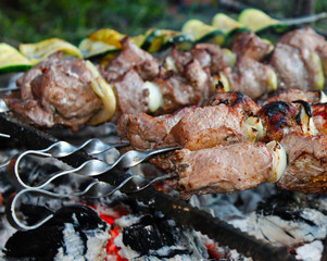 shish kebab on skewers on fire