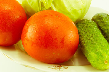 Cucumber and tomato with measuring